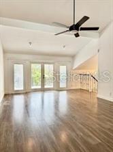 512 Wideview Avenue Tarpon Springs, FL 34689 - Photo 4 of 30 a view of an empty room with wooden floor and a window