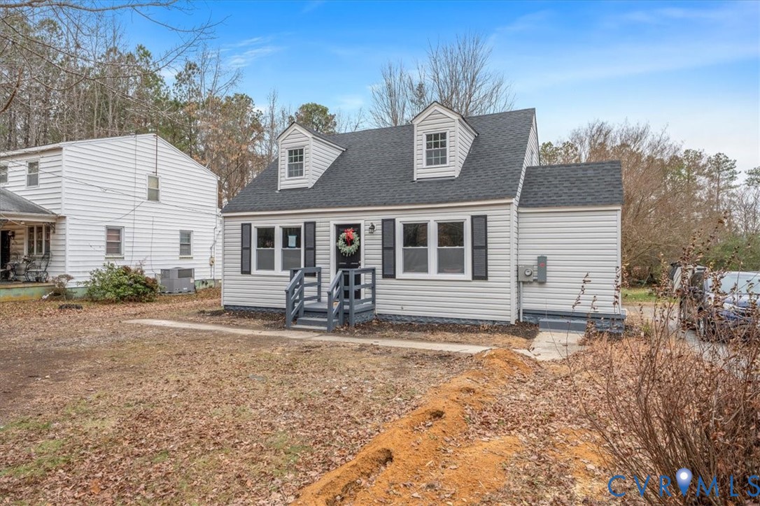 1989 Cox Road Blackstone, VA 23824 - Photo 6 of 44 New england style home featuring a shingled roof