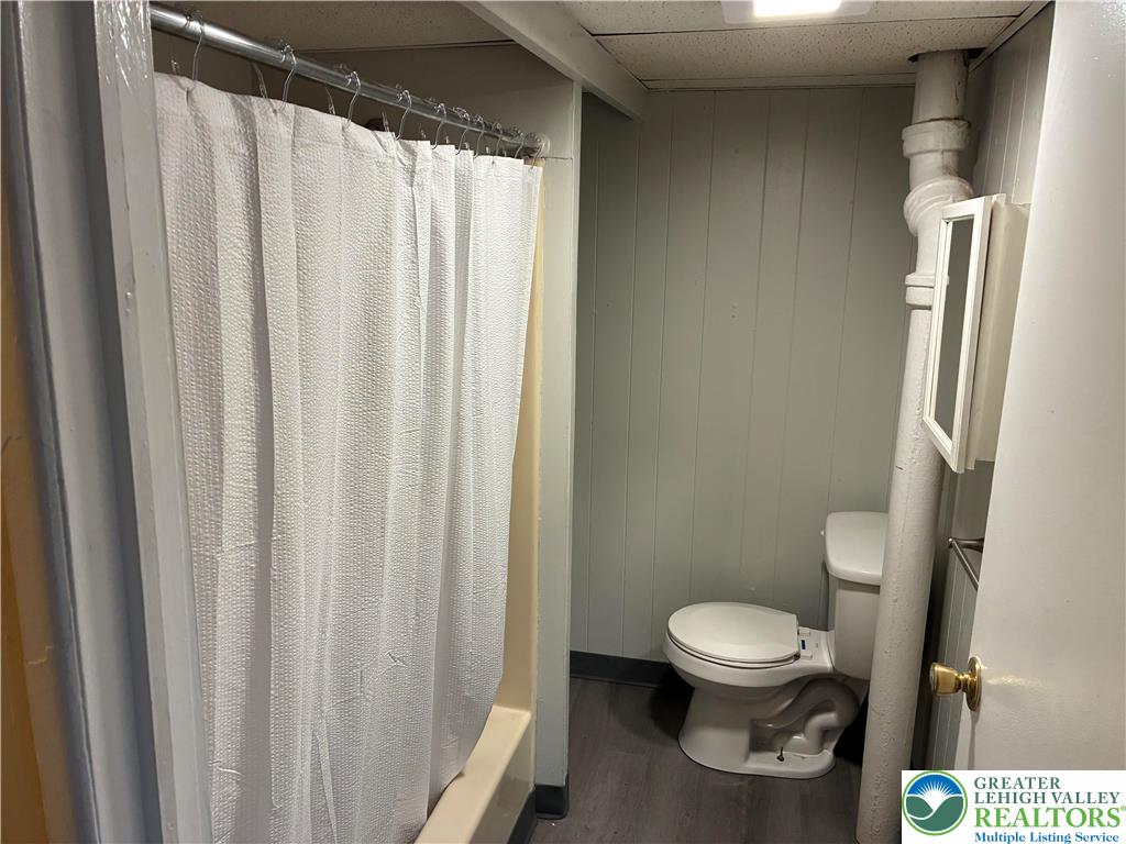 515 Breck Street, Unit 2 Scranton, PA 18505 - Photo 3 of 7 a white toilet sitting next to a small sink