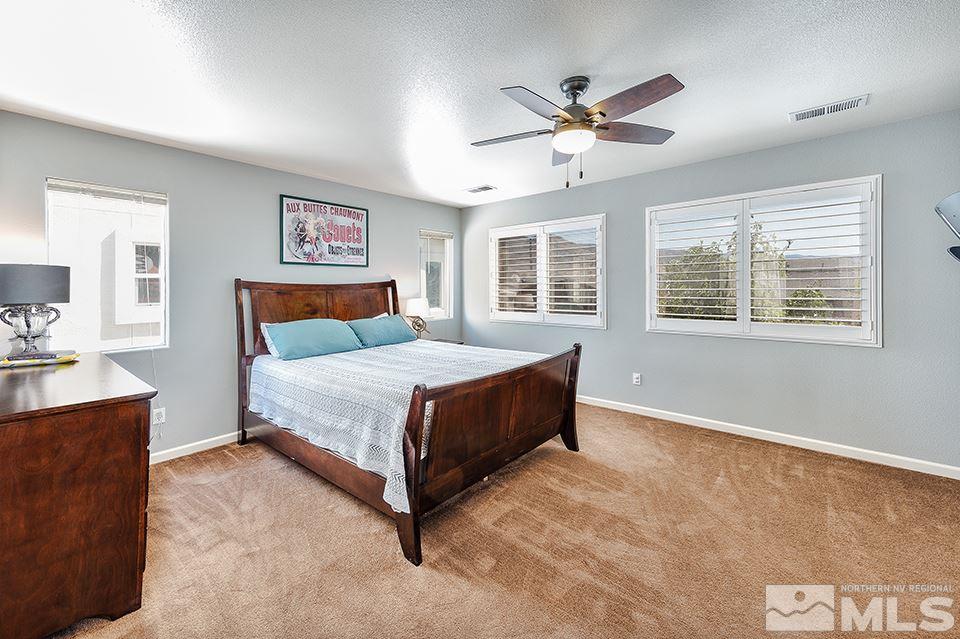 2252 Big Trail Circle Reno, NV 89521 - Photo 12 of 21 a bedroom with a large bed and a window