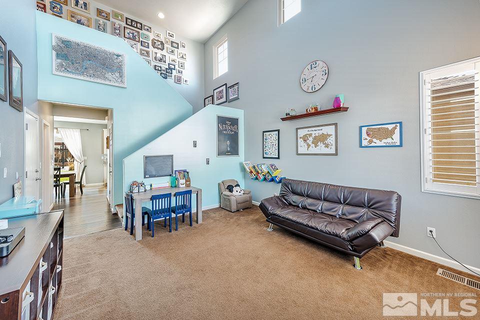 2252 Big Trail Circle Reno, NV 89521 - Photo 3 of 21 a living room with furniture and a chandelier