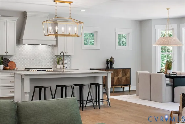 a bedroom with a white bed and white couch