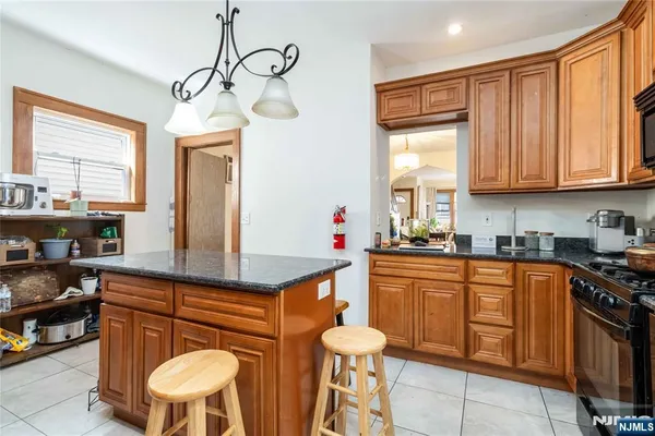 a kitchen with stainless steel appliances granite countertop counter space a sink and cabinets