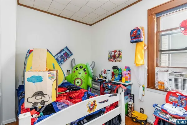 kids room with toys and a book shelf