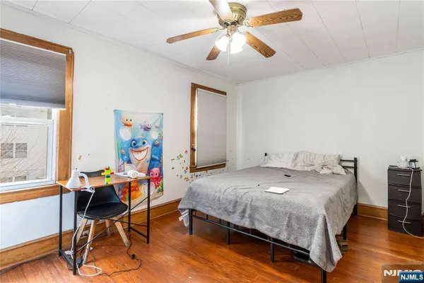 a bedroom with a bed and a table in it