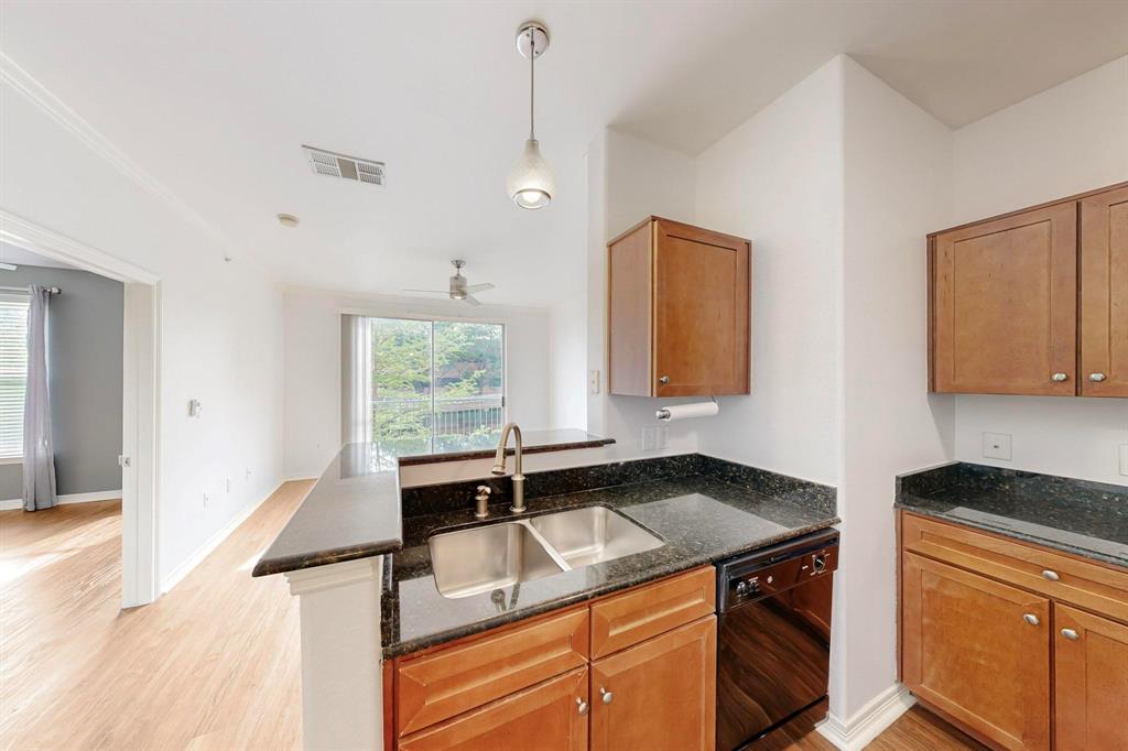 330 Las Colinas Boulevard East, Unit 342 Irving, TX 75039 - Photo 1 of 19 a kitchen with a sink and a window