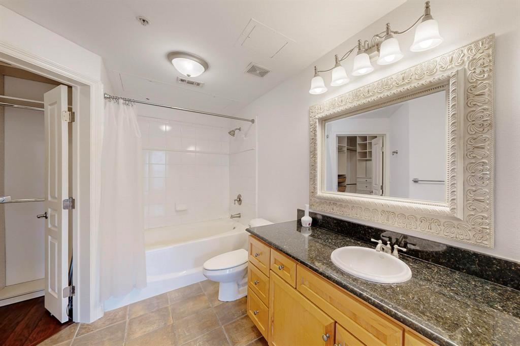 330 Las Colinas Boulevard East, Unit 342 Irving, TX 75039 - Photo 12 of 19 a bathroom with a granite countertop double vanity sink mirror and a bathtub