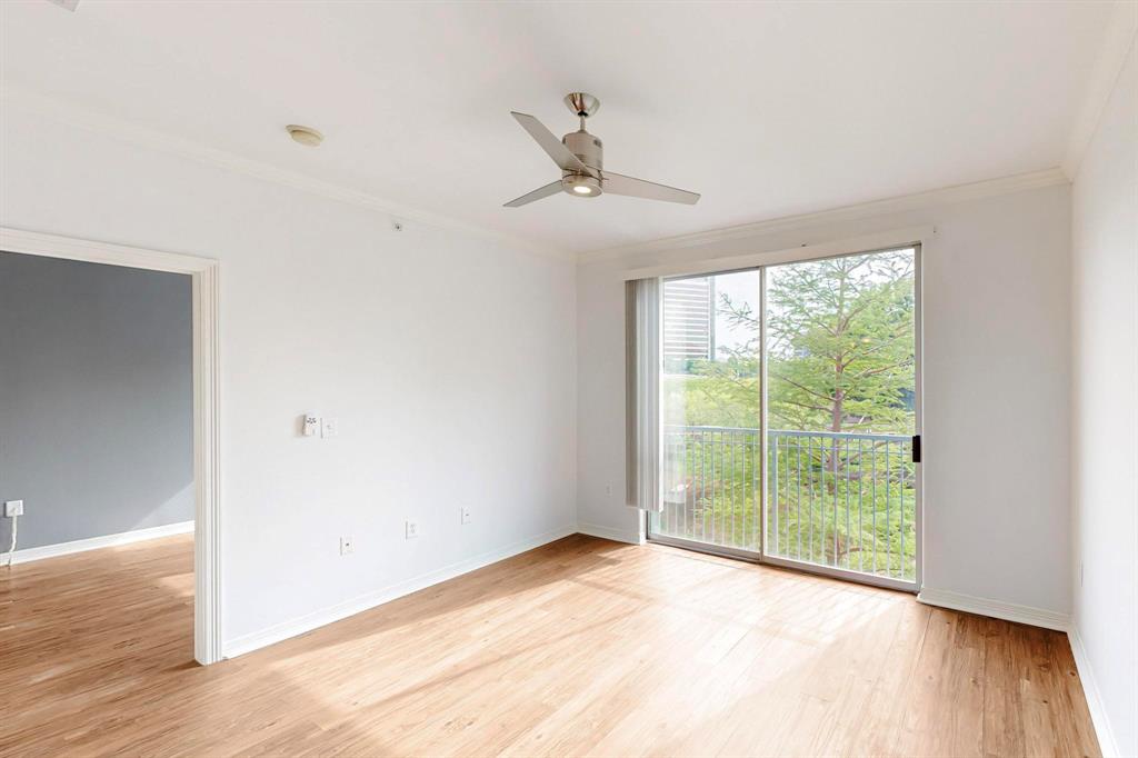 330 Las Colinas Boulevard East, Unit 342 Irving, TX 75039 - Photo 6 of 19 a view of an empty room with wooden floor and a window