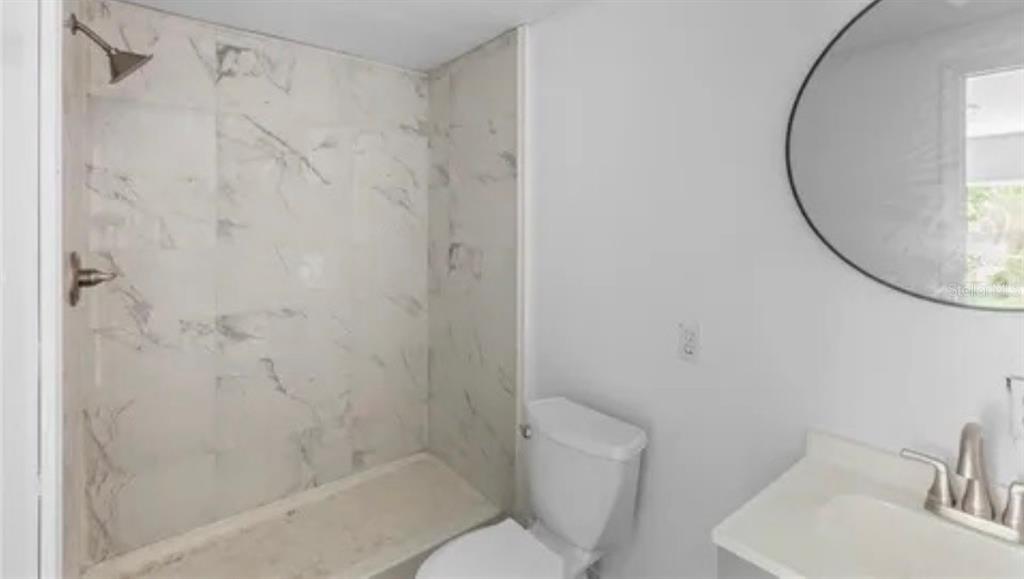 6287 Magnolia Street Keystone Heights, FL 32656 - Photo 24 of 27 a bathroom with a sink and a mirror