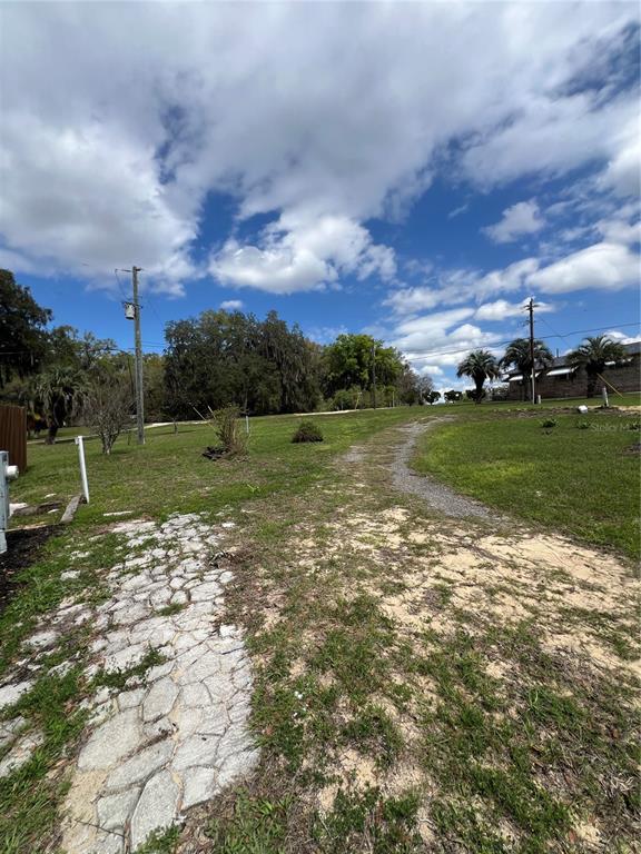 6287 Magnolia Street Keystone Heights, FL 32656 - Photo 3 of 27 a view of a golf course with a lake