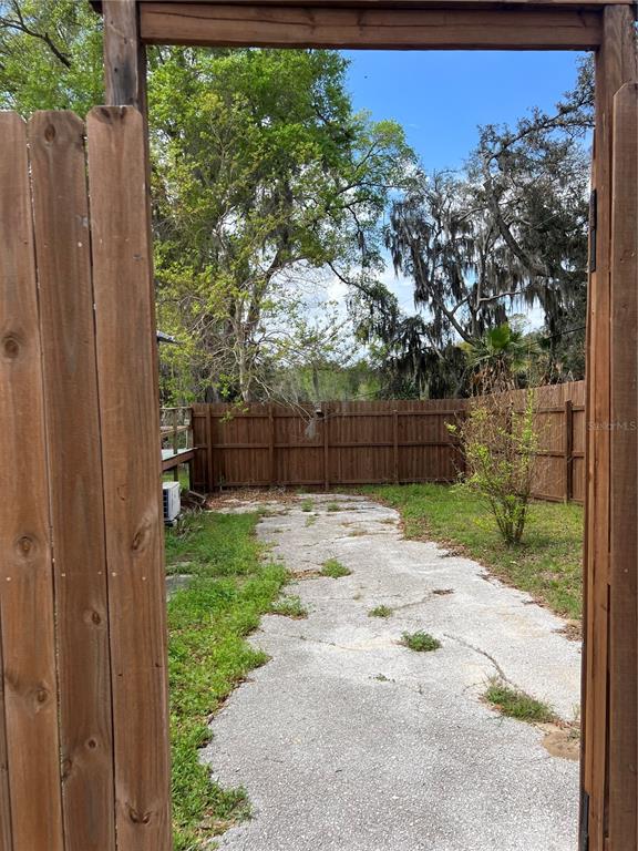 6287 Magnolia Street Keystone Heights, FL 32656 - Photo 4 of 27 a backyard of a house with lots of green space