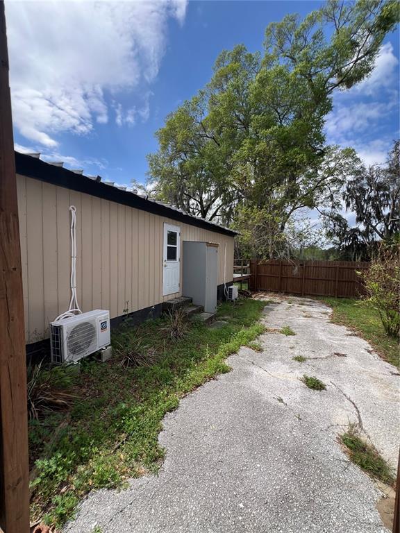 6287 Magnolia Street Keystone Heights, FL 32656 - Photo 6 of 27 a backyard of a house with lots of green space