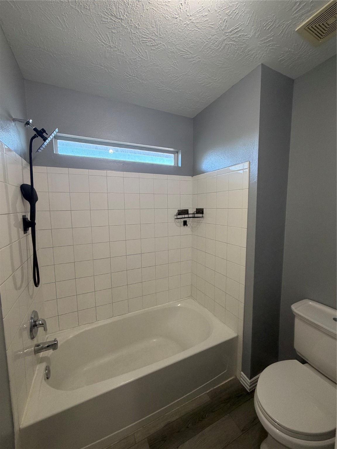 4623 Mi Castillo Court Houston, TX 77045 - Photo 17 of 25 a bathroom with a bathtub and a toilet