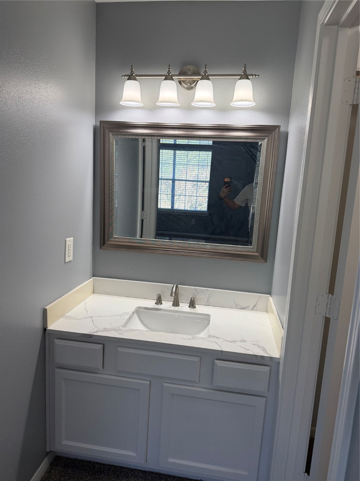 4623 Mi Castillo Court Houston, TX 77045 - Photo 18 of 25 a bathroom with a sink and a mirror