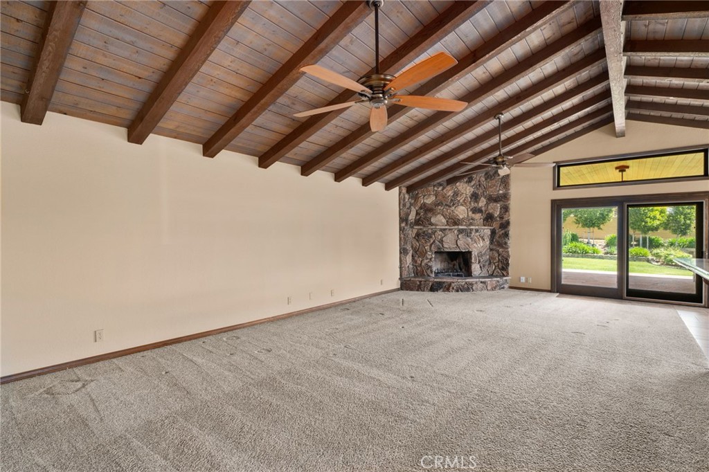 5297 Amethyst Street Rancho Cucamonga, CA 91737 - Photo 15 of 64 a view of an empty room with a fireplace and a window