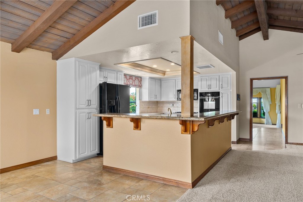 5297 Amethyst Street Rancho Cucamonga, CA 91737 - Photo 19 of 64 a view of kitchen with stainless steel appliances granite countertop refrigerator and microwave