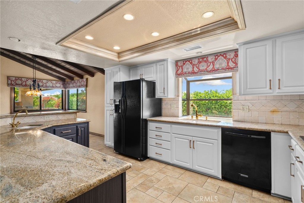 5297 Amethyst Street Rancho Cucamonga, CA 91737 - Photo 20 of 64 a kitchen with stainless steel appliances granite countertop sink stove and refrigerator