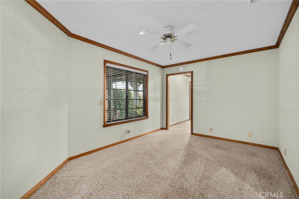 5297 Amethyst Street Rancho Cucamonga, CA 91737 - Photo 38 of 64 an empty room with chandelier fan and windows