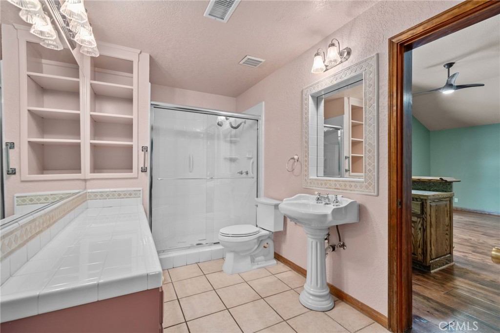 5297 Amethyst Street Rancho Cucamonga, CA 91737 - Photo 40 of 64 a bathroom with a sink toilet and shower