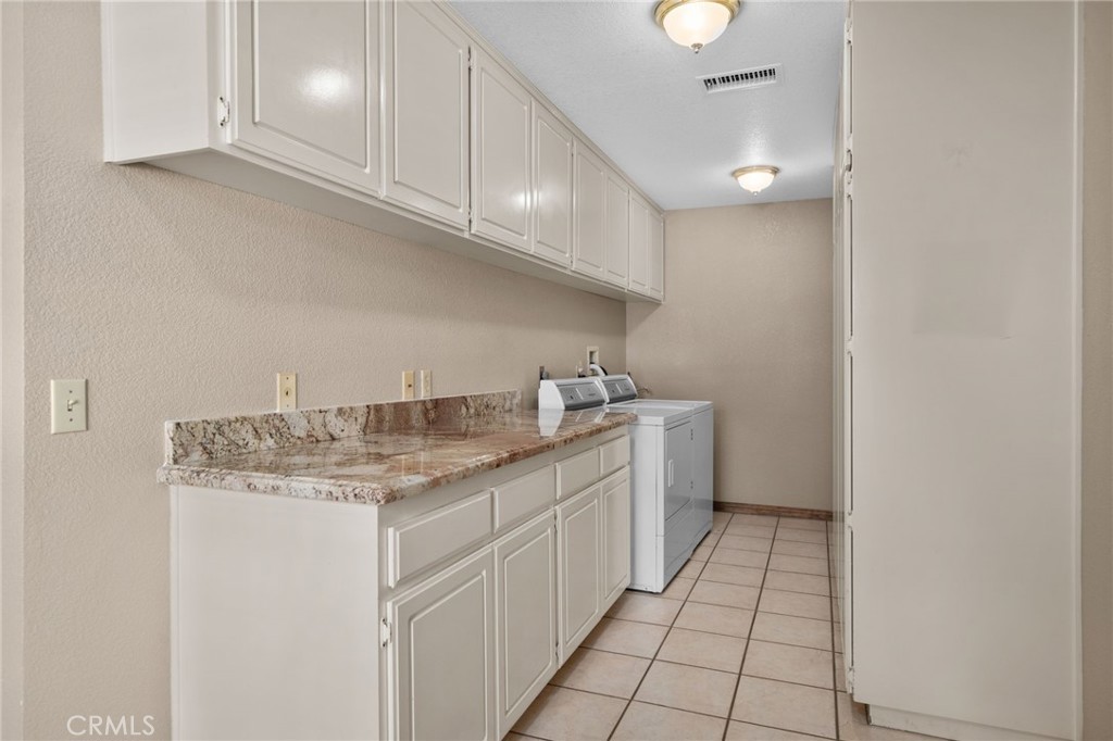 5297 Amethyst Street Rancho Cucamonga, CA 91737 - Photo 45 of 64 a kitchen with a sink cabinets and window