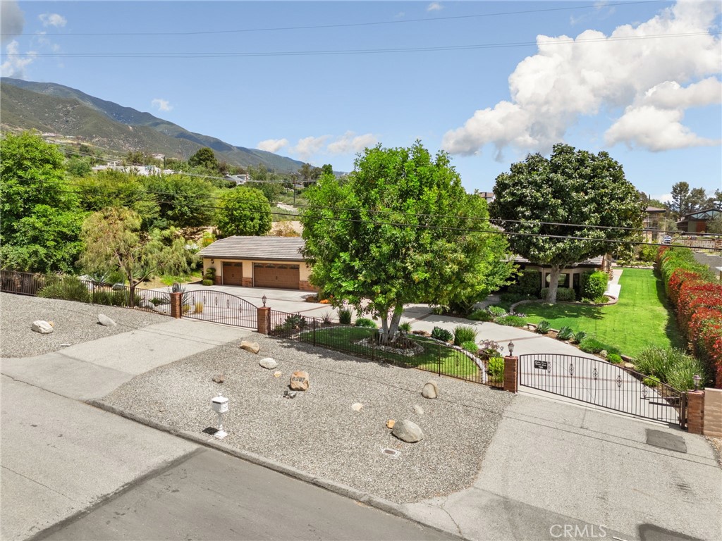5297 Amethyst Street Rancho Cucamonga, CA 91737 - Photo 55 of 64 a pathway of a house with a yard and fence