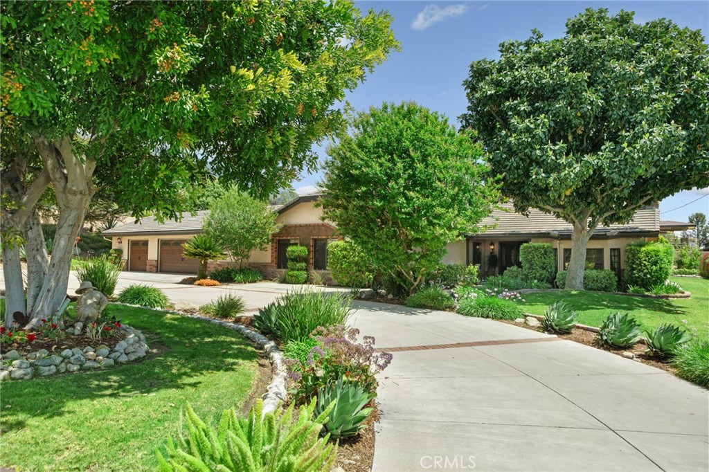 5297 Amethyst Street Rancho Cucamonga, CA 91737 - Photo 64 of 64 front view of a house with a yard