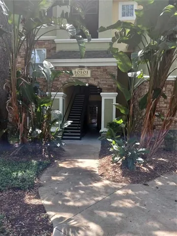 a view of a building with a yard