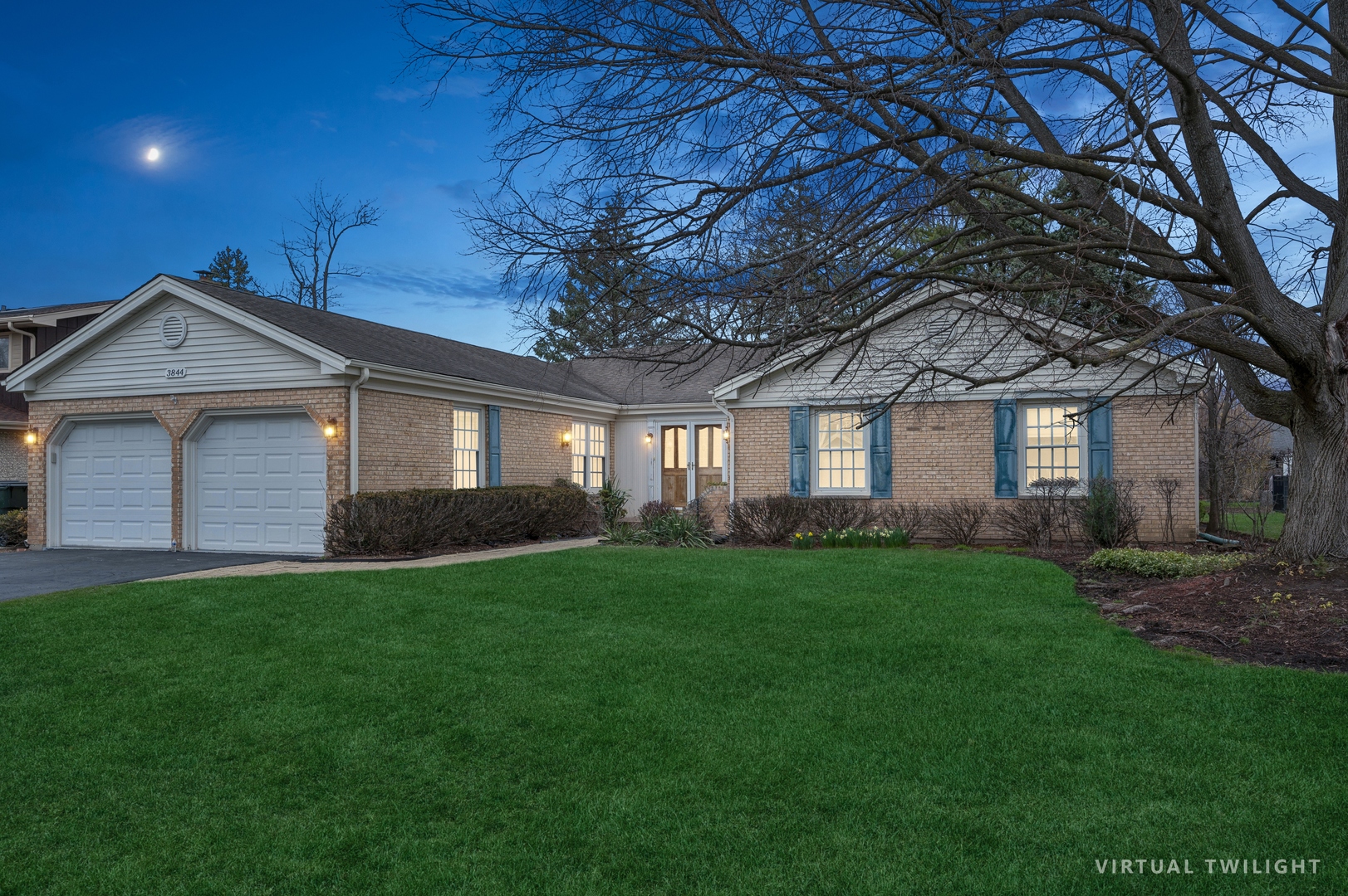 3844 Grace Lane Glenview, IL 60025 - Photo 2 of 34 a front view of a house with a garden