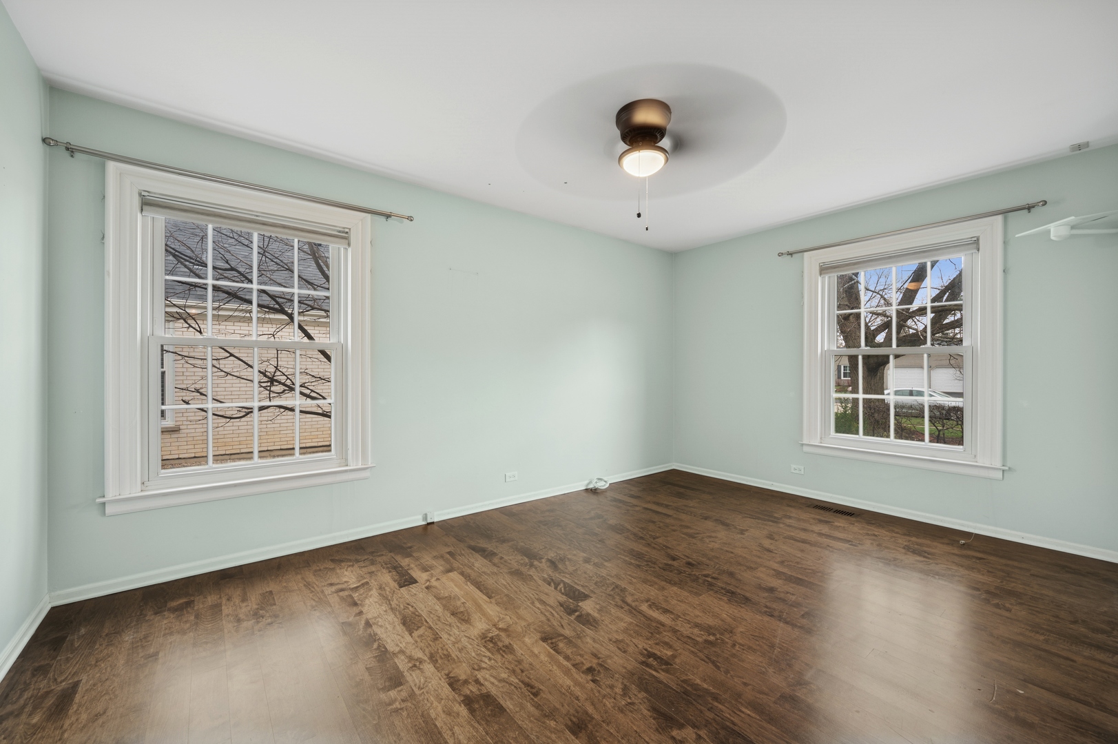 3844 Grace Lane Glenview, IL 60025 - Photo 23 of 34 a view of an empty room with a window and wooden floor