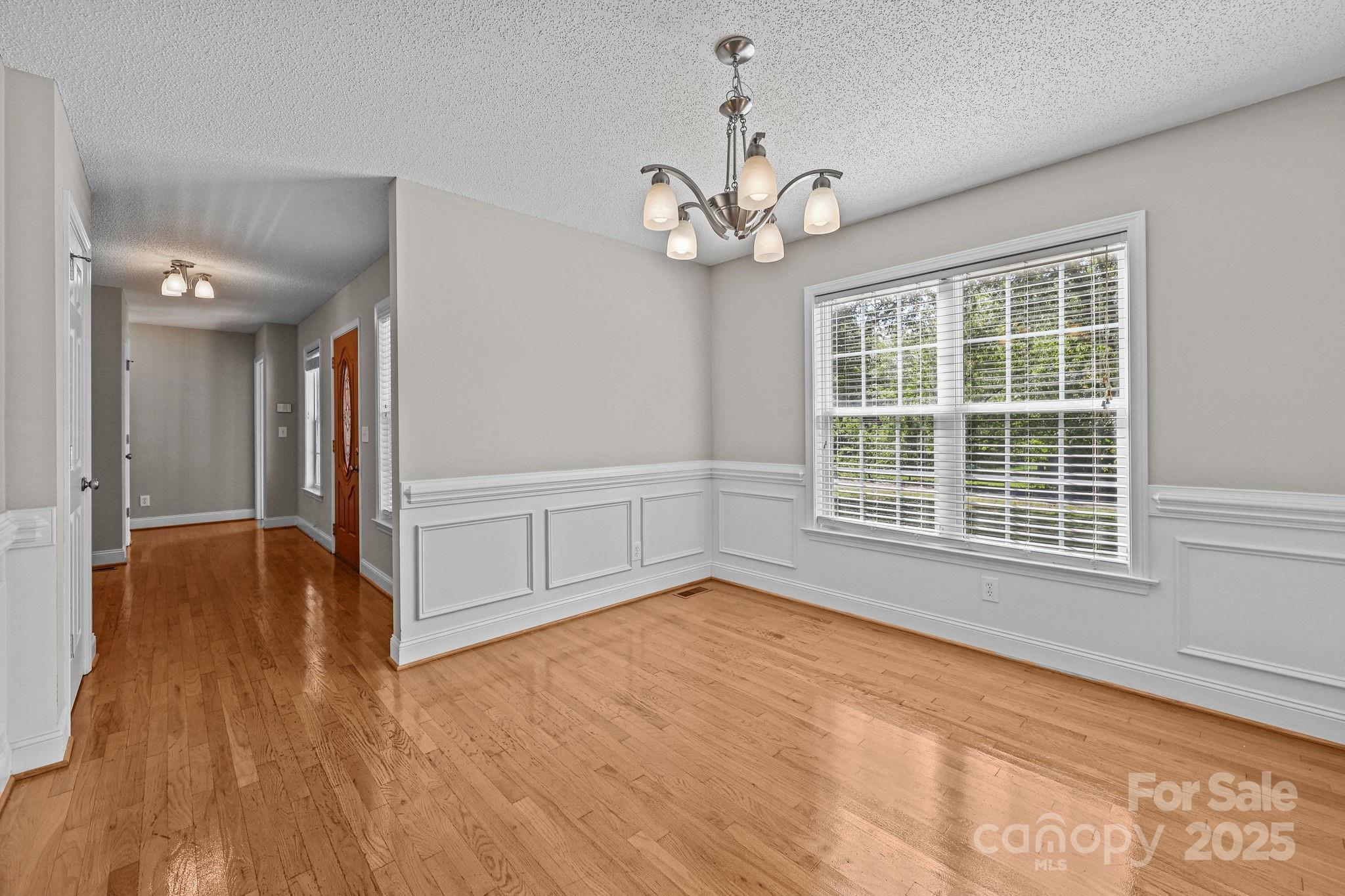 190 Teague Road Salisbury, NC 28146 - Photo 18 of 44 a view of an empty room with wooden floor and a window