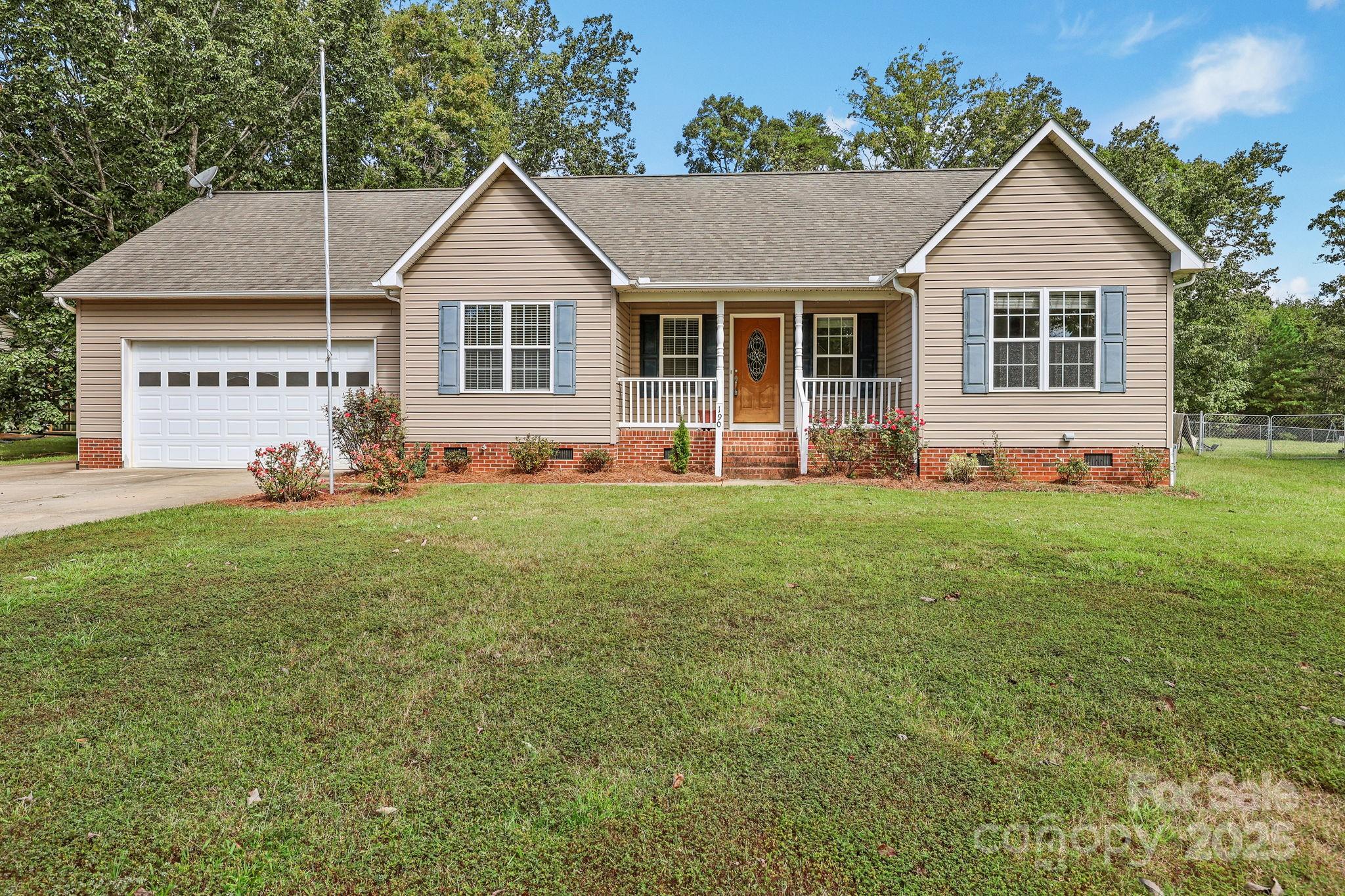 190 Teague Road Salisbury, NC 28146 - Photo 2 of 44 a front view of a house with a garden and yard
