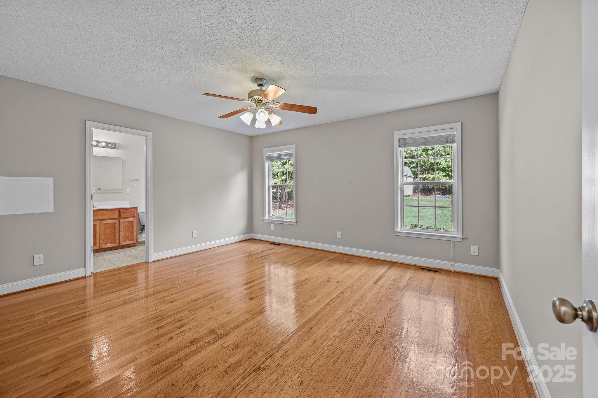 190 Teague Road Salisbury, NC 28146 - Photo 24 of 44 a view of an empty room with a window and wooden floor