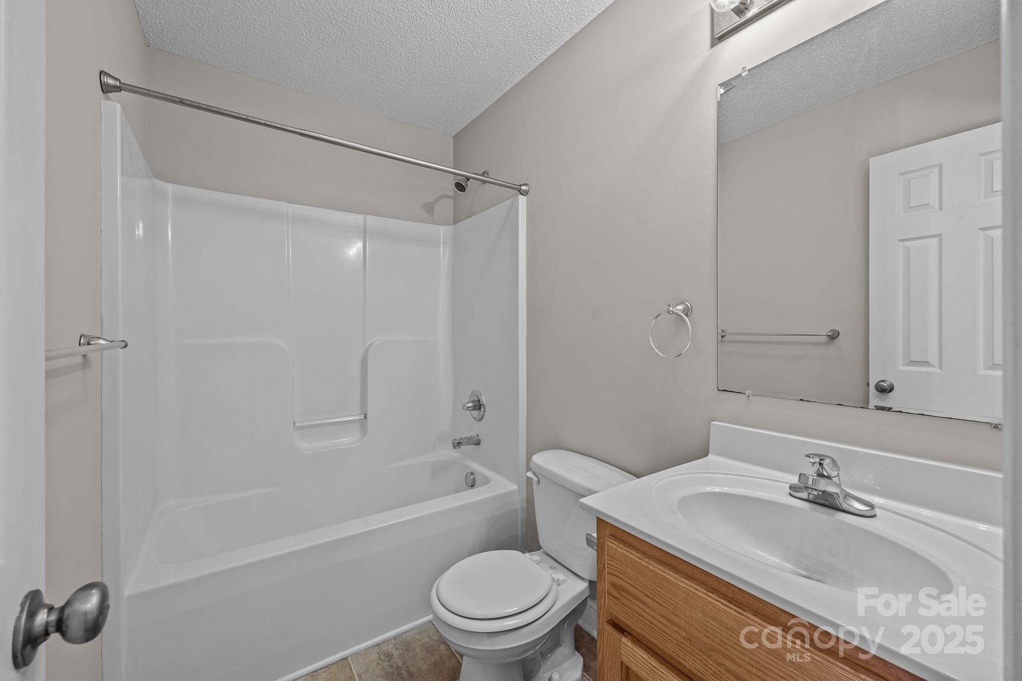 190 Teague Road Salisbury, NC 28146 - Photo 27 of 44 a bathroom with a granite countertop bathtub shower sink mirror vanity and toilet