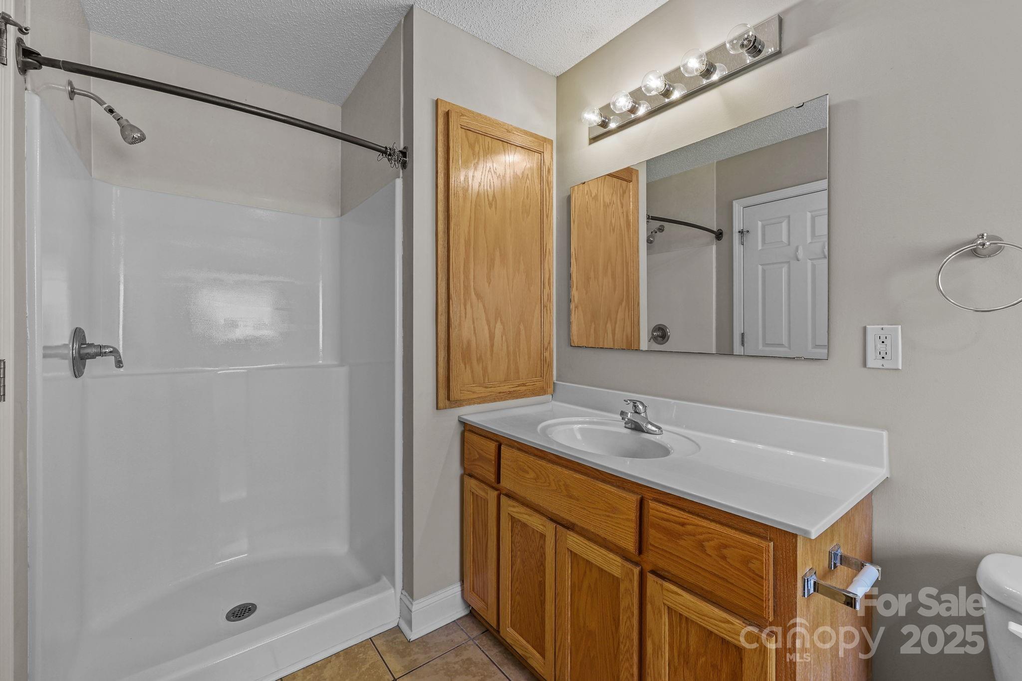 190 Teague Road Salisbury, NC 28146 - Photo 28 of 44 a bathroom with a shower sink and mirror