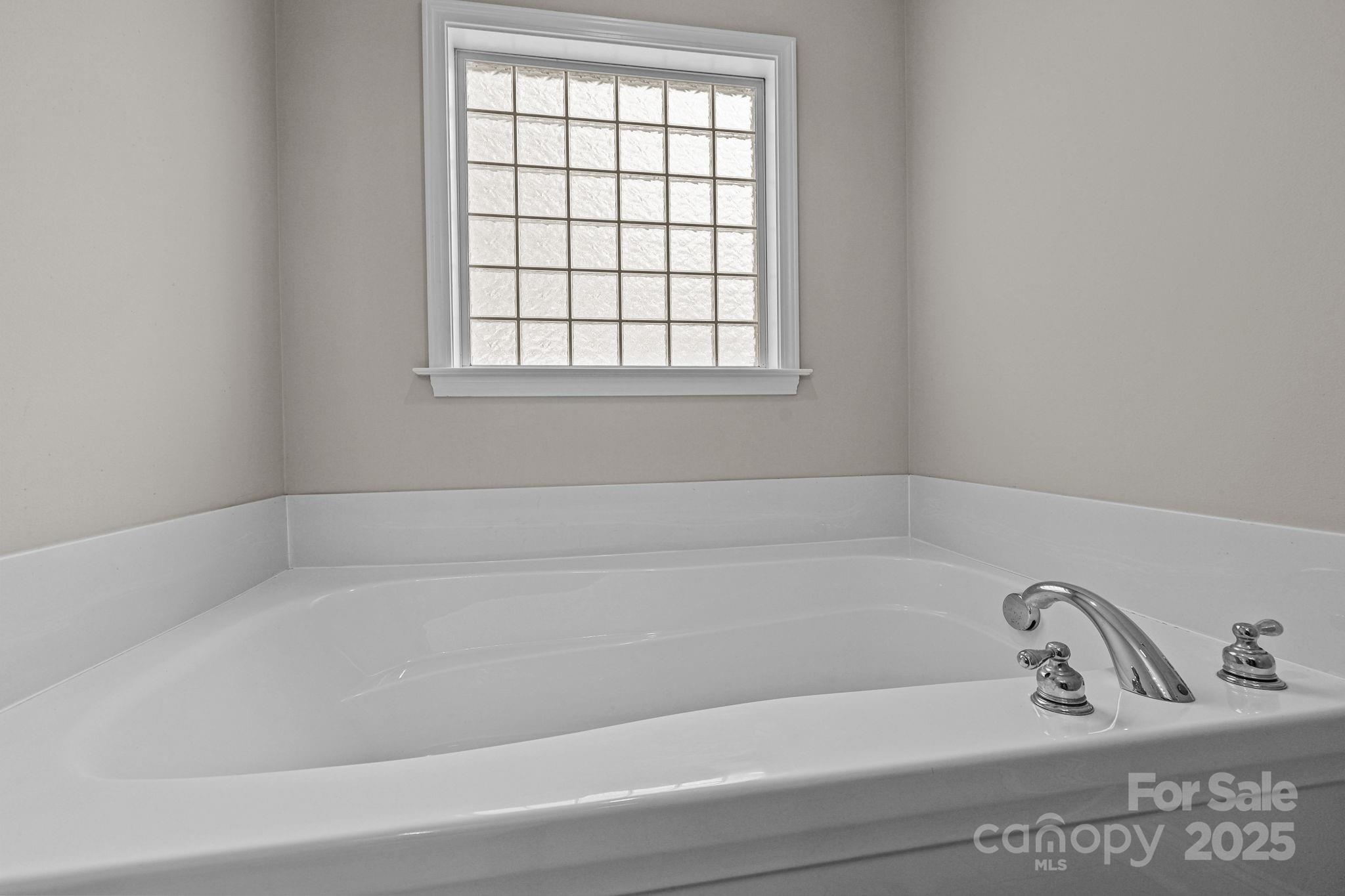 190 Teague Road Salisbury, NC 28146 - Photo 29 of 44 a white bath tub sitting next to a window