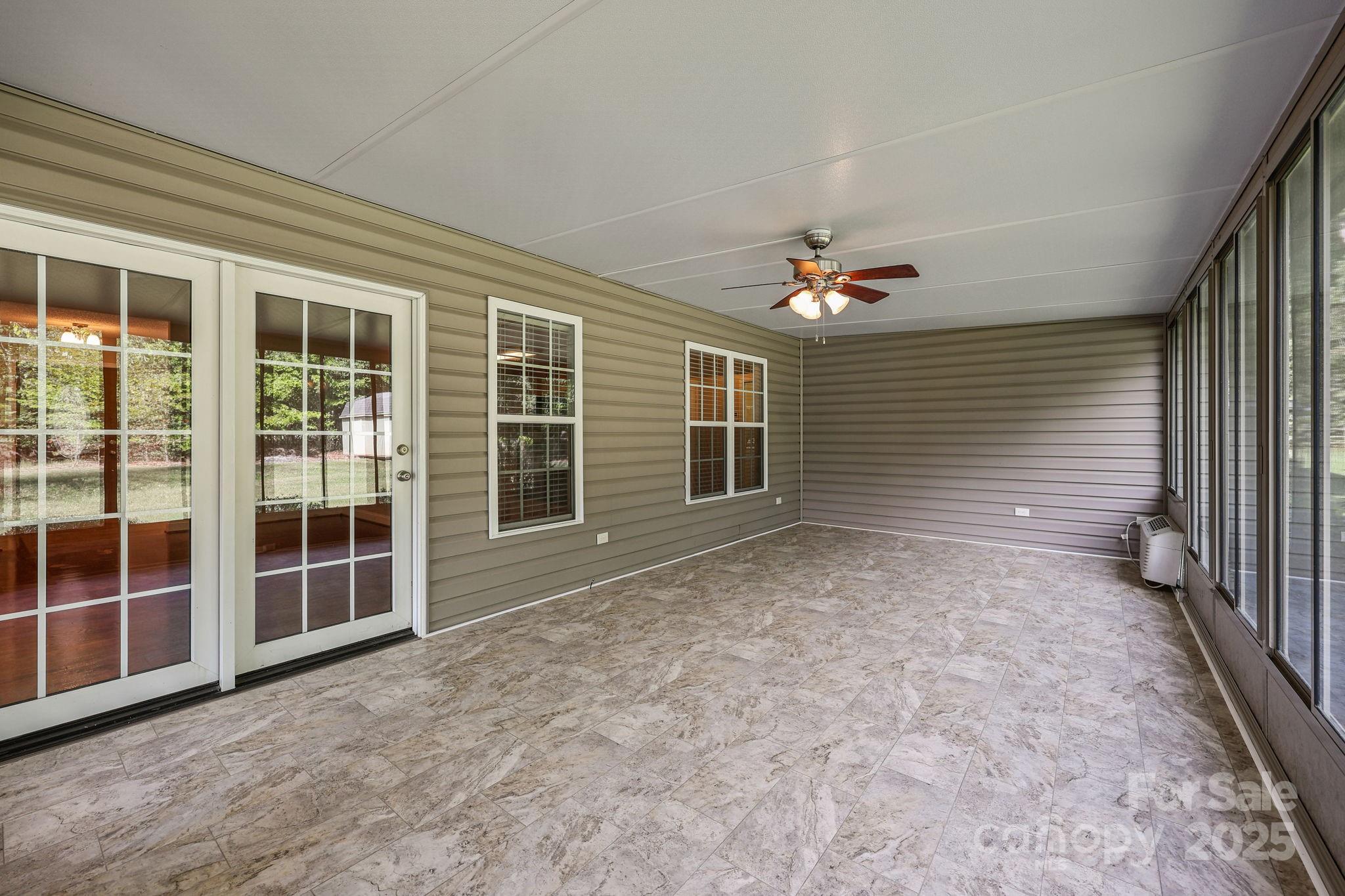 190 Teague Road Salisbury, NC 28146 - Photo 37 of 44 a view of a livingroom with a ceiling fan and window