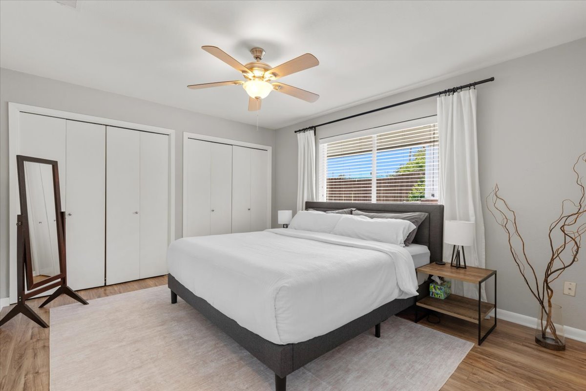 208 Skyloop Drive Austin, TX 78745 - Photo 14 of 34 Comfortable primary suite on 1st FL with a large window, updated flooring, and generous closet space.