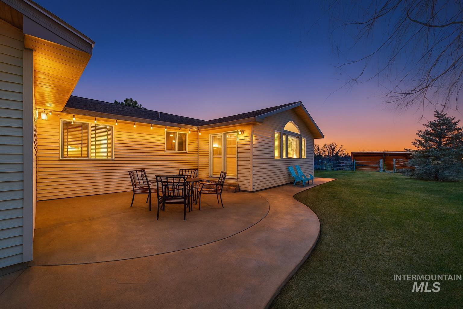 Patio terrace at dusk featuring a patio area