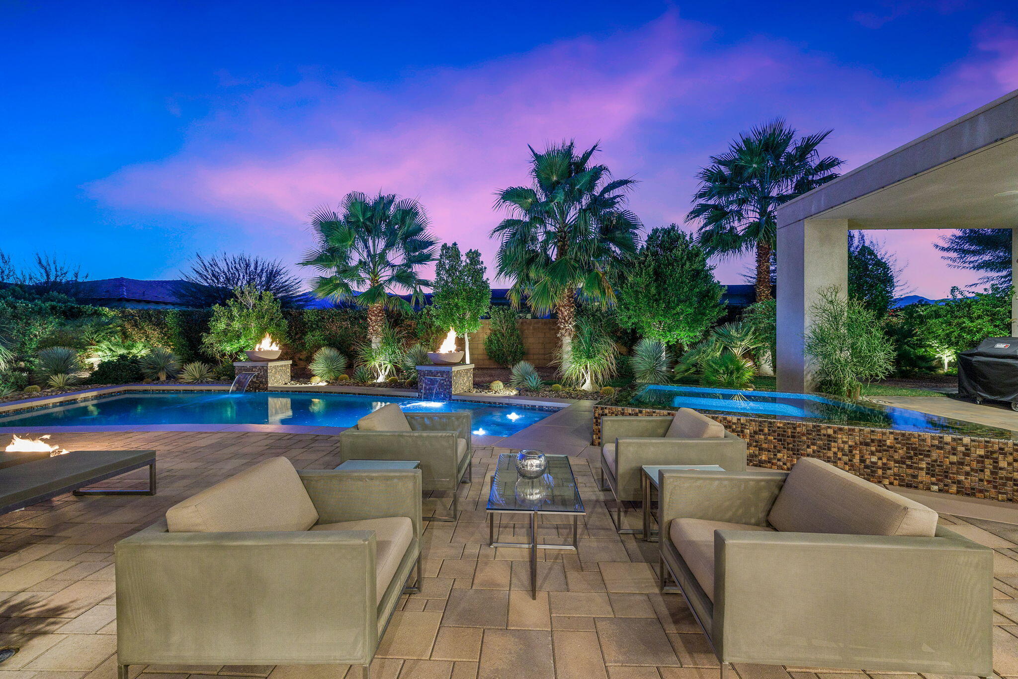5 Via Merenda Rancho Mirage, CA 92270 - Photo 12 of 84 a view of a patio with couches and table with swimming pool