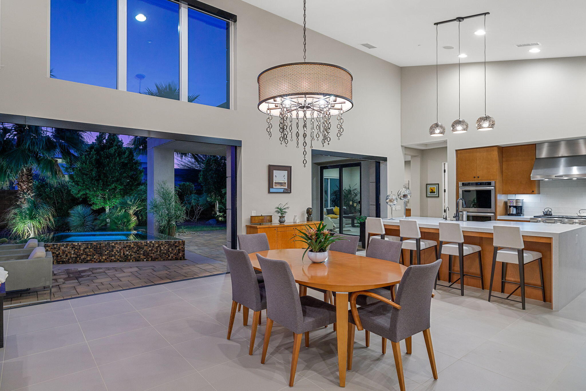 5 Via Merenda Rancho Mirage, CA 92270 - Photo 19 of 84 a view of a dining room with furniture and chandelier