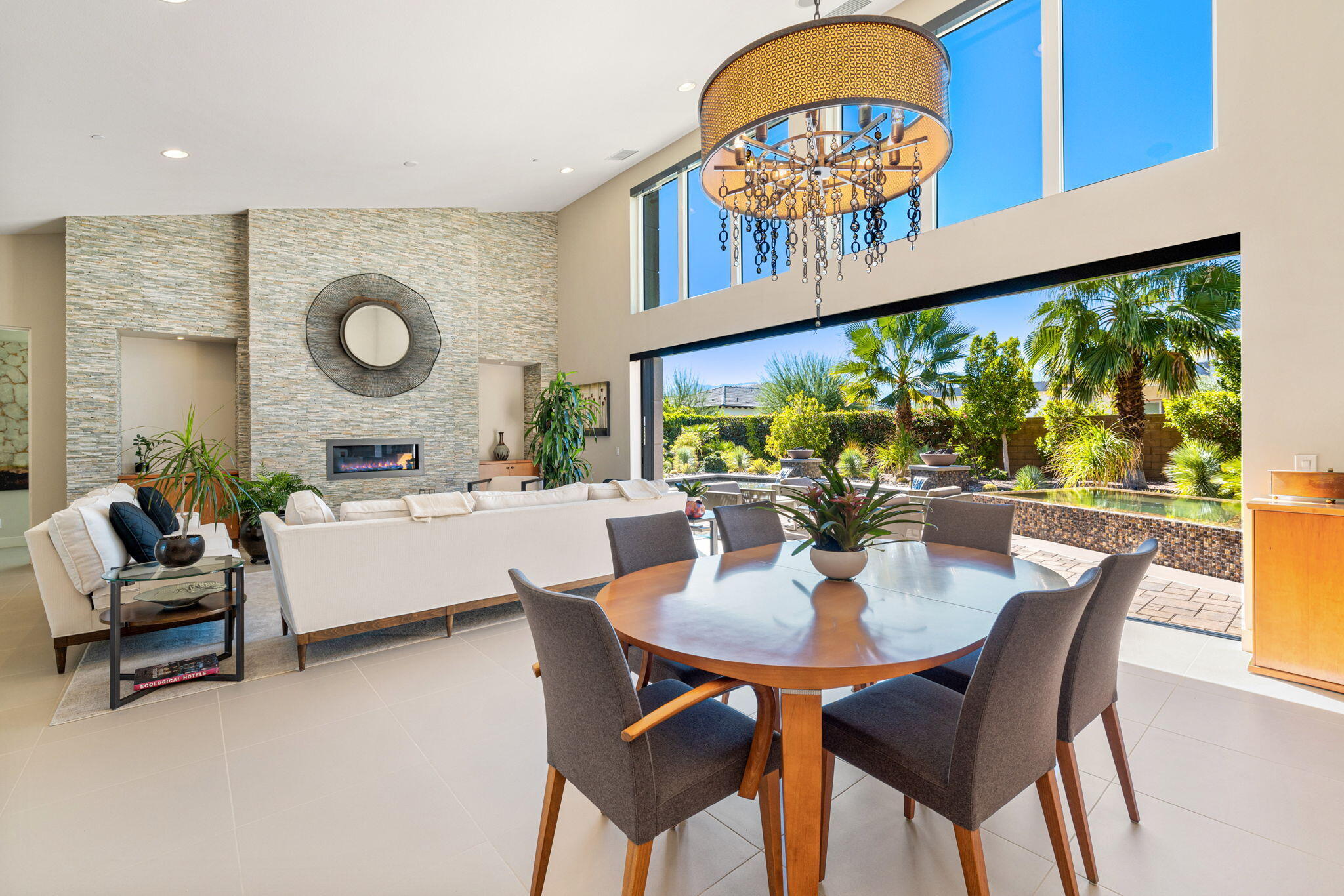 5 Via Merenda Rancho Mirage, CA 92270 - Photo 20 of 84 a living room with furniture a rug and a large window