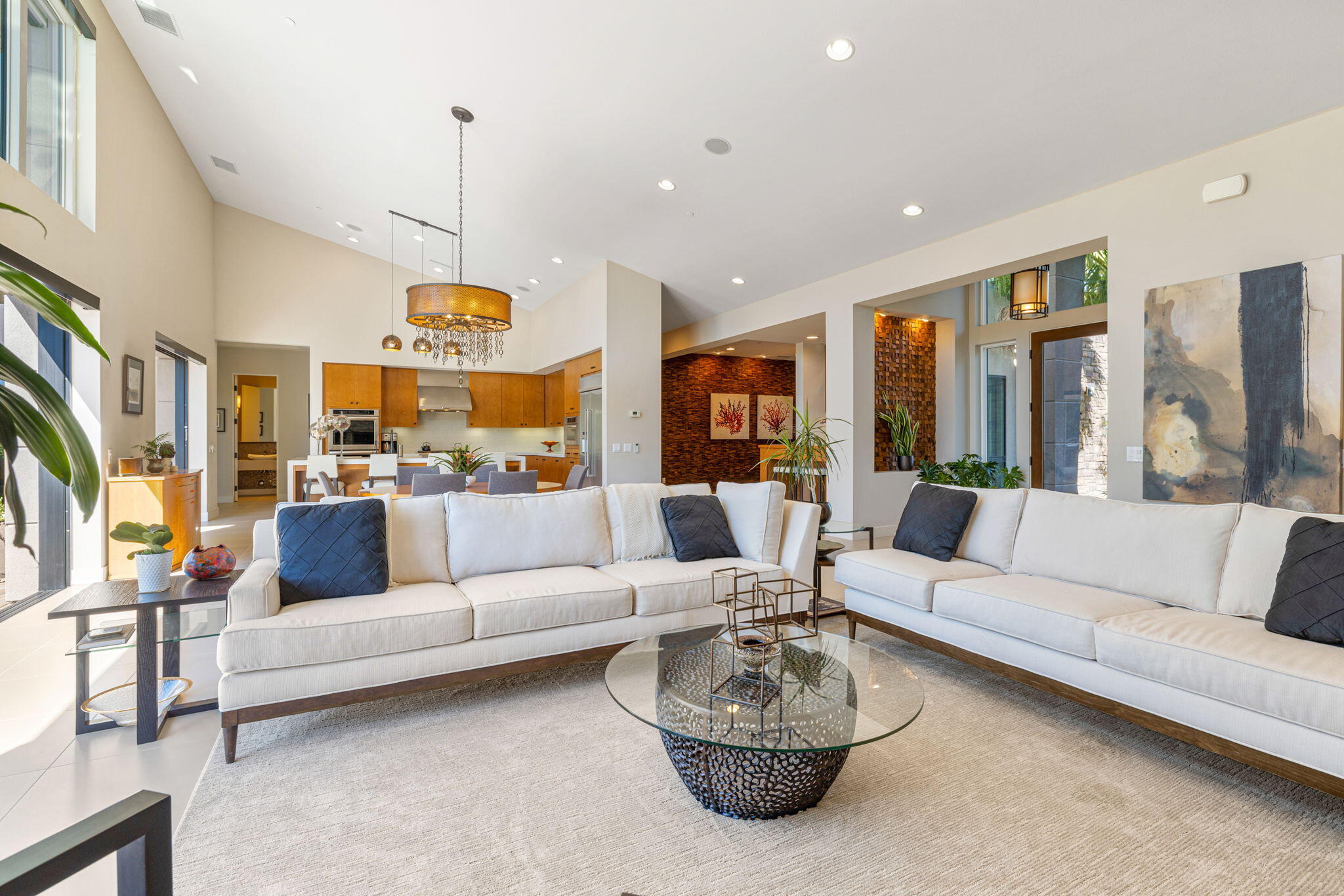 5 Via Merenda Rancho Mirage, CA 92270 - Photo 24 of 84 a living room with furniture kitchen view and a chandelier