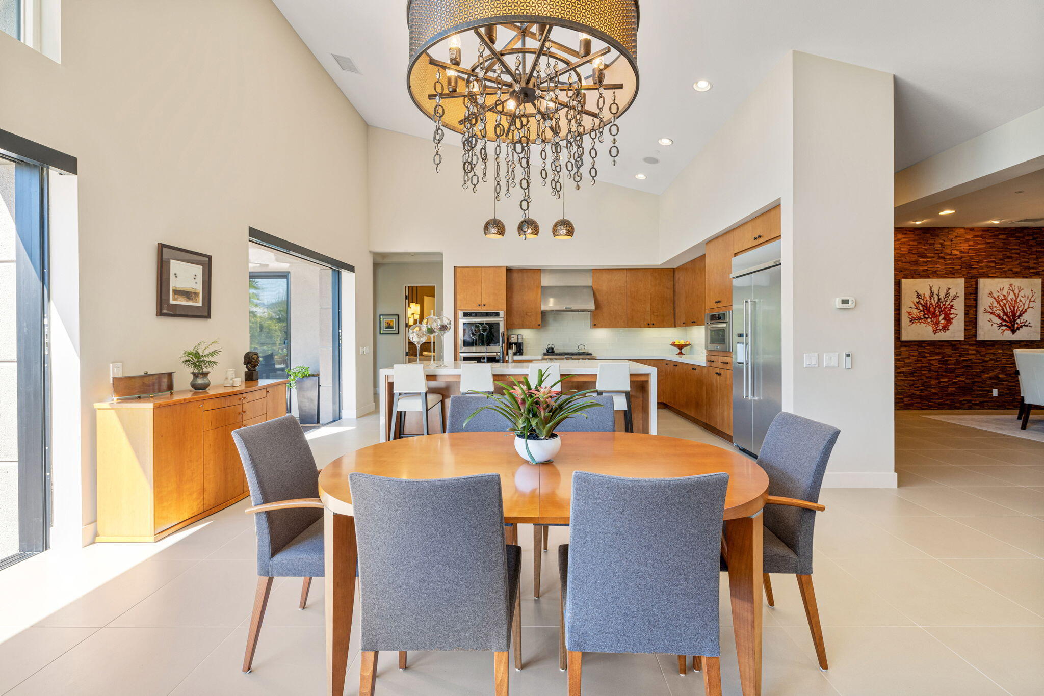 5 Via Merenda Rancho Mirage, CA 92270 - Photo 29 of 84 a view of a dining room with furniture wooden floor and chandelier