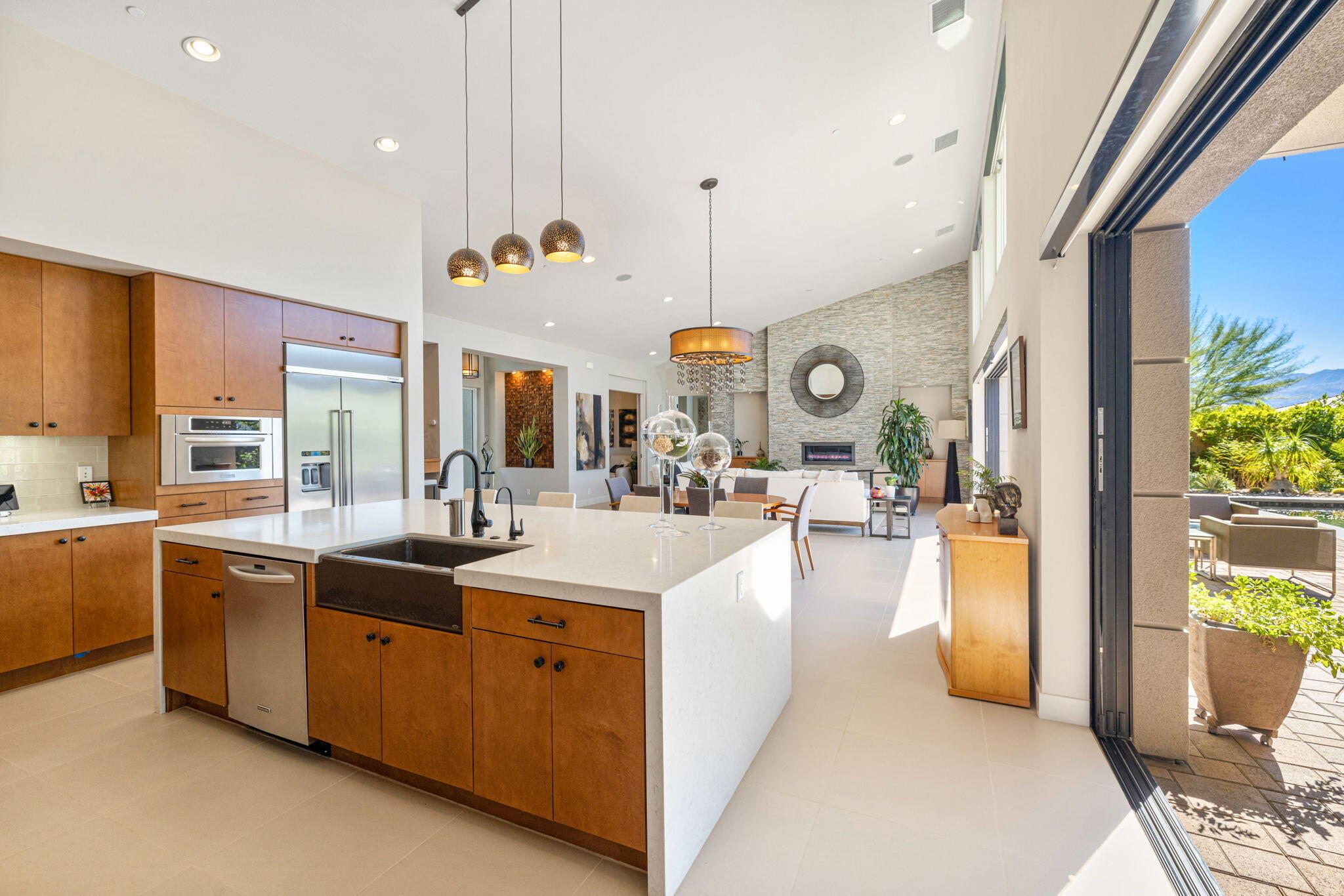 5 Via Merenda Rancho Mirage, CA 92270 - Photo 37 of 84 a large kitchen with stainless steel appliances kitchen island granite countertop a lot of counter top space