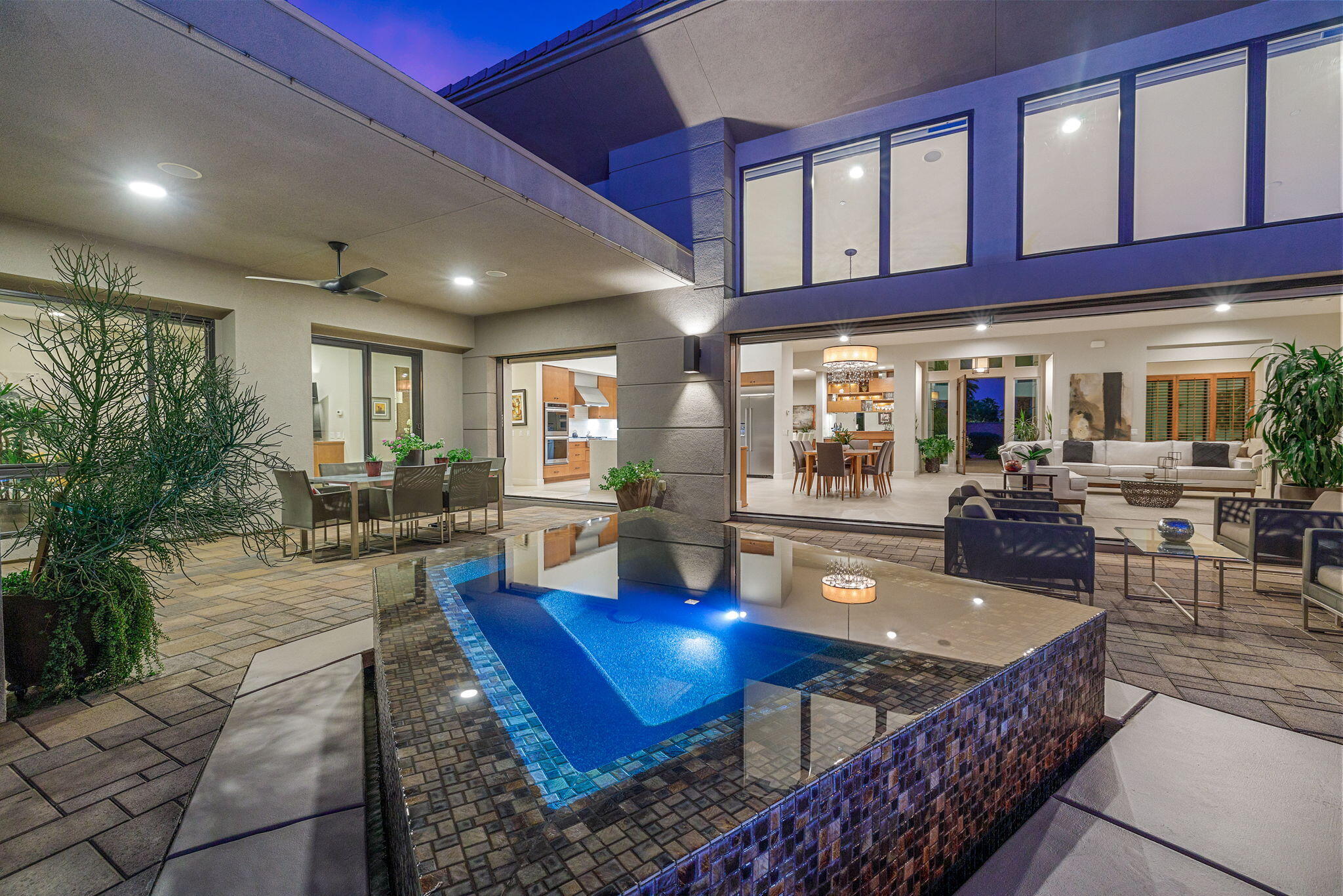 5 Via Merenda Rancho Mirage, CA 92270 - Photo 4 of 84 a living room with furniture a large window and wooden floor