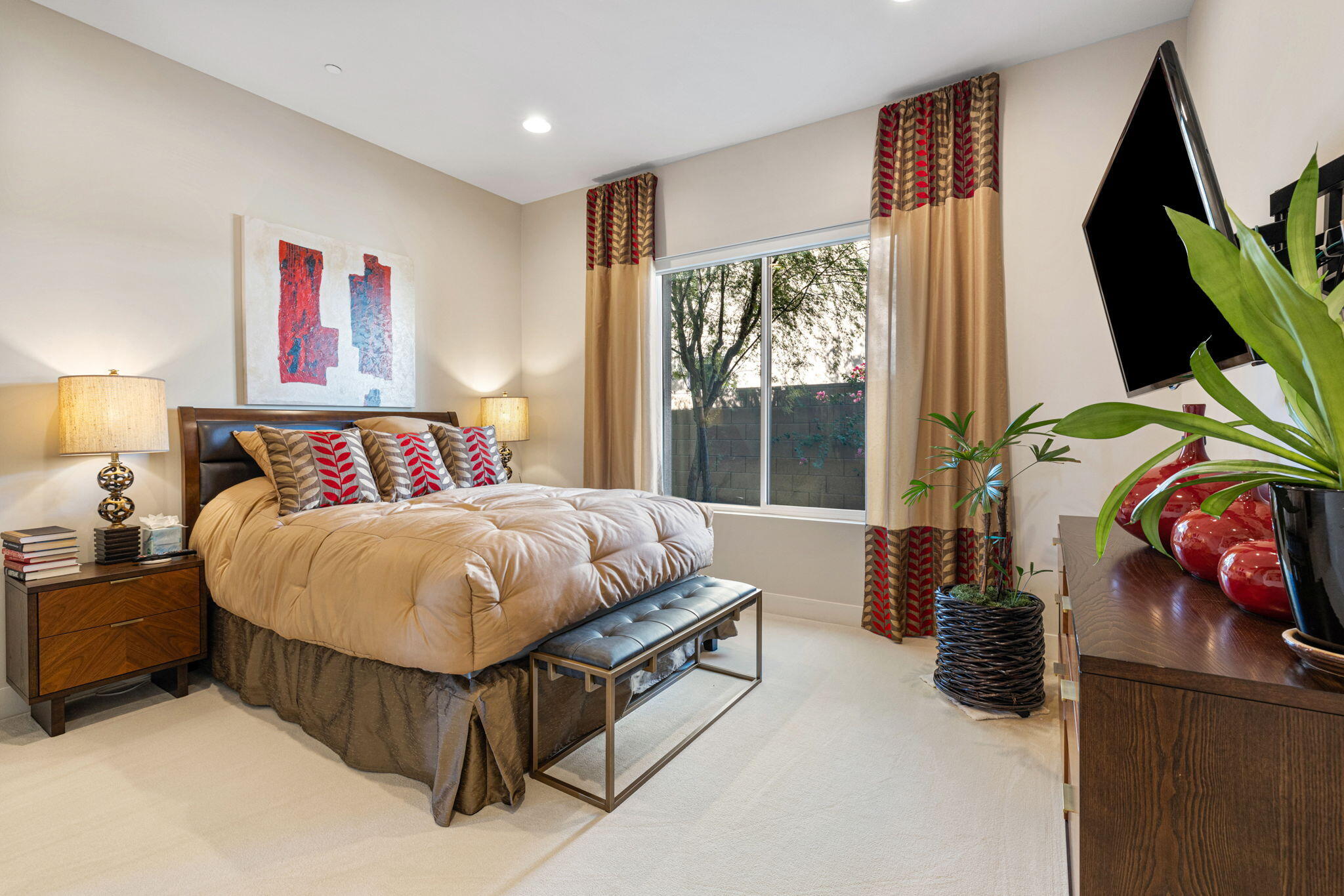 5 Via Merenda Rancho Mirage, CA 92270 - Photo 62 of 84 a spacious bedroom with a bed and a flat tv screen