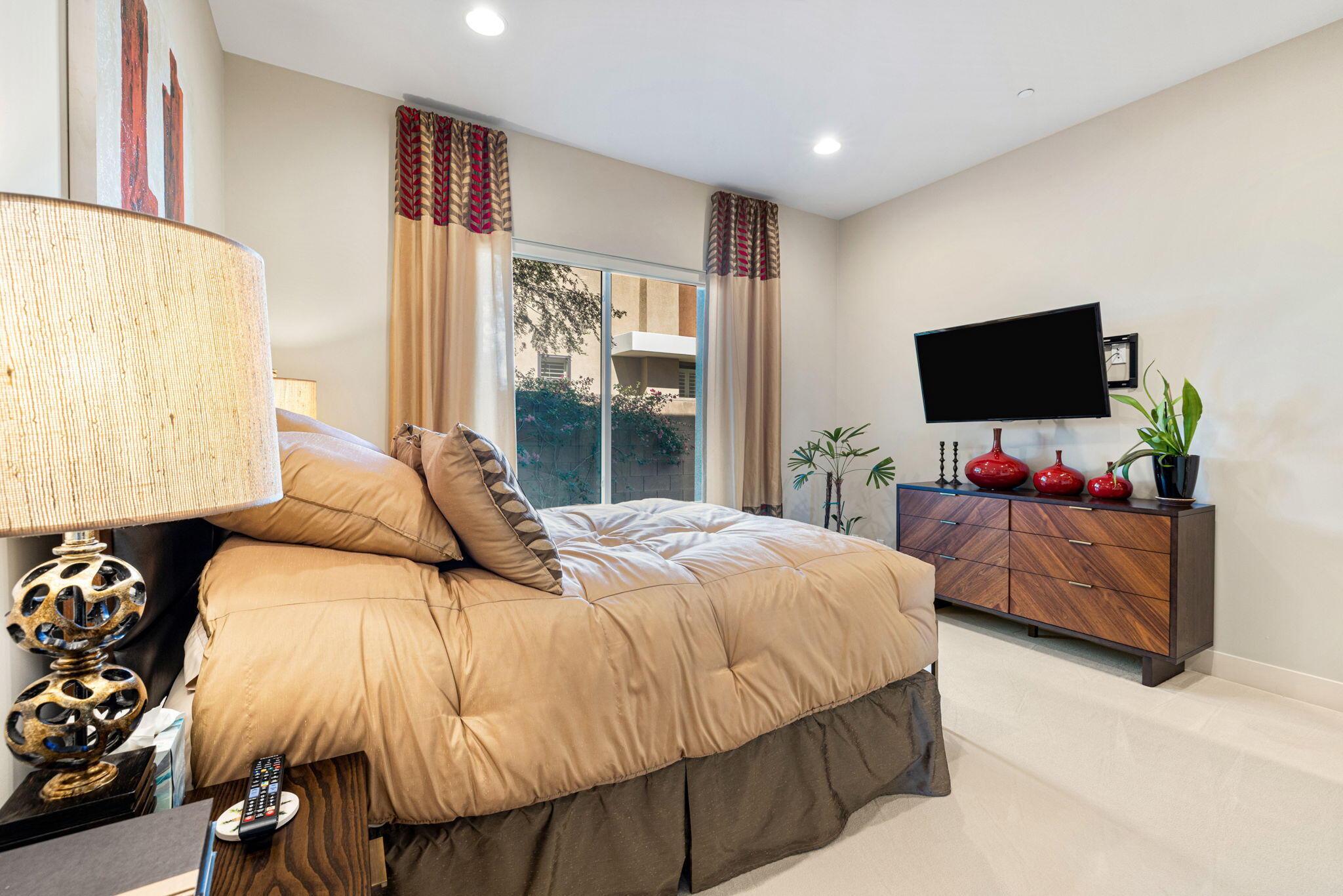 5 Via Merenda Rancho Mirage, CA 92270 - Photo 63 of 84 a bedroom with a bed and flat screen tv