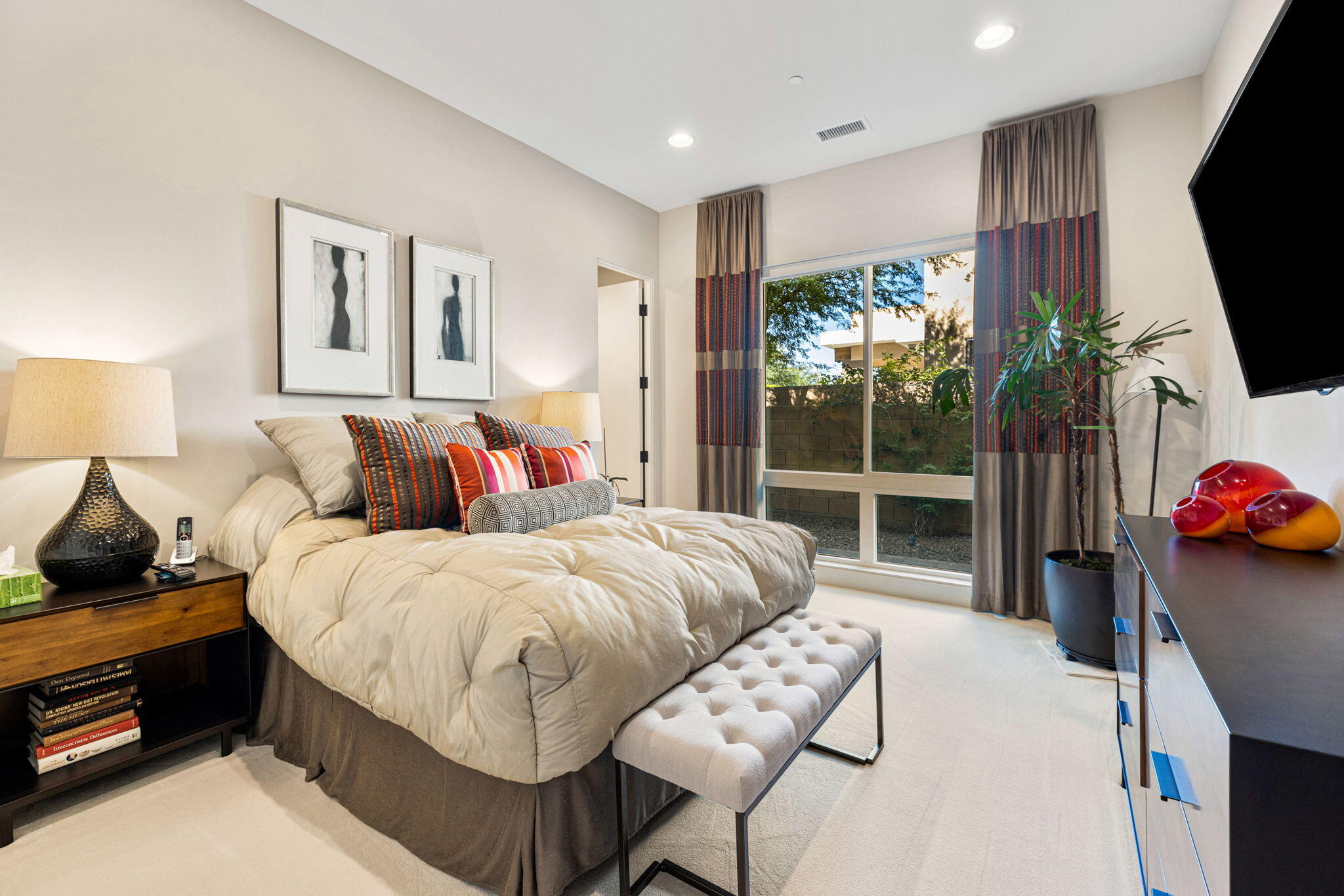 5 Via Merenda Rancho Mirage, CA 92270 - Photo 66 of 84 a spacious bedroom with a bed and flat screen tv
