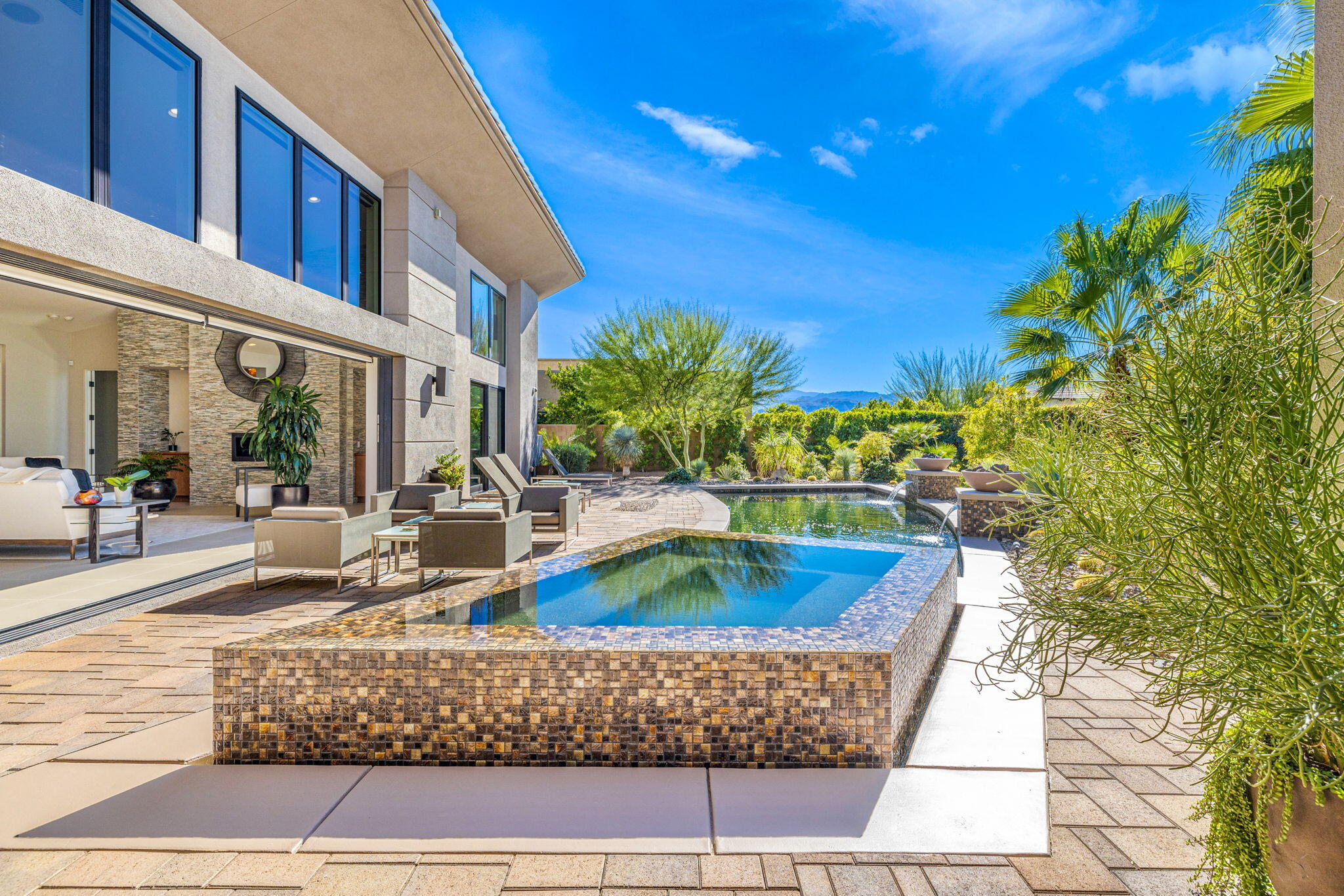 5 Via Merenda Rancho Mirage, CA 92270 - Photo 82 of 84 a view of swimming pool with outdoor seating and plants