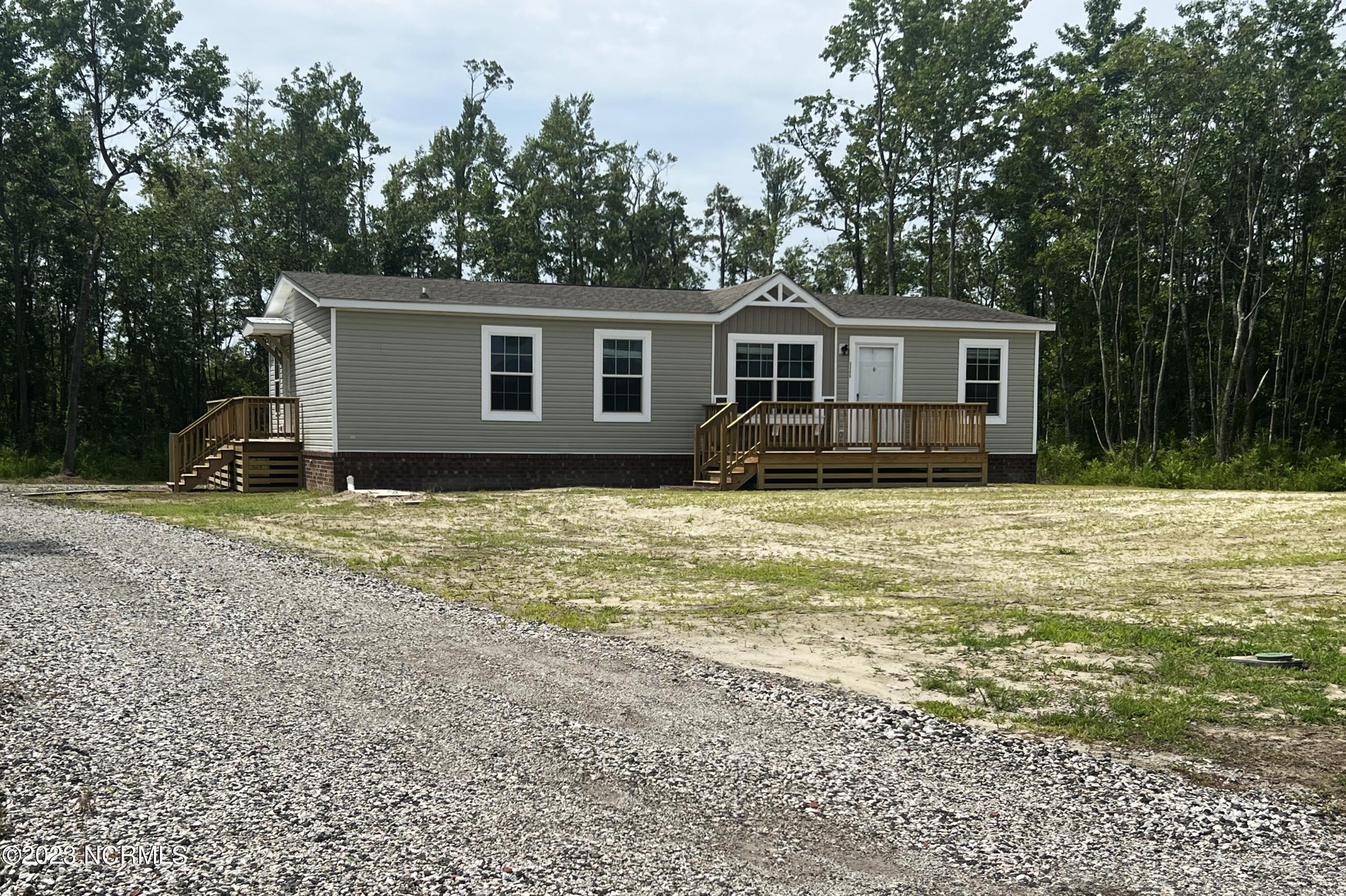 3245 Albemarle Church Road Columbia, NC 27925 - Photo 49 of 53 Rock driveway with parking spaces behind home
